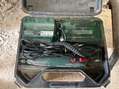 a tool in the case that is sitting on the floor
