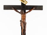 a close up of a wooden cross with a jesus on it