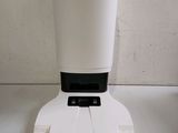 a white blender with a cup on top of it