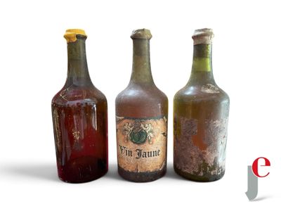 three old bottles that are sitting next to each other