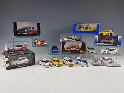 many different models of cars in a display case