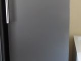 two refrigerators that are next to each other in the kitchen