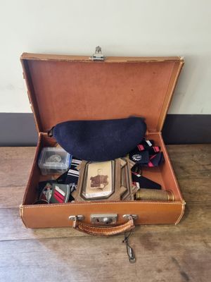 a suitcase with a lot of things in it on the floor