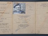 an old passport with a picture of a woman on it