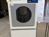 a washing machine sitting on a pallet in a warehouse