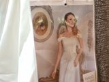 a picture of a woman in a wedding dress hanging on a wall