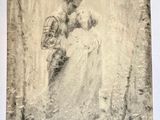 an old photo of a man and a woman kissing in the woods