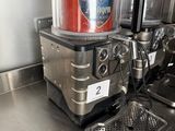 two soda dispensers on the counter in the kitchen