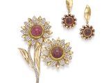 two ruby and diamond flower brooches and a pair of earrings