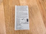 a box with a label on it sitting on a wooden table