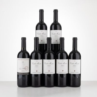 six bottles of red wine are lined up on a table