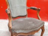 an image of a chair sitting in front of a red wall