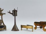 several different types of brass objects are displayed on a white surface
