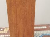a vase that is sitting on top of a wooden block
