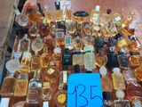 many bottles of alcohol on a table with a price tag