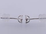 a pair of sterling silver earrings on a white background