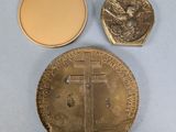 an image of a gold coin with a cross on it and a coin with a medal on it
