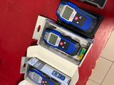 three cell phones sitting on top of each other on the wall