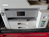 a printer that is sitting on top of a red box