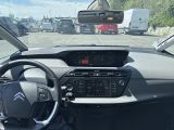 dashboard view of a car driving on a highway with a lot of cars