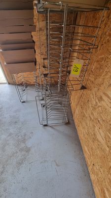 several shopping carts are lined up against a wall in a store