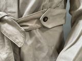 a close up of a jacket with a belt on it