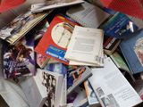 a box full of books that are sitting on the floor