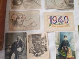 many old postcards on the table with pictures on them