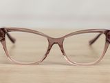 the glasses are made of plastic and have a brown frame