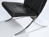 black leather lounge chair with chrome frame and black leather seat