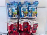 a lot of toothbrushes and toothpaste packages on the counter
