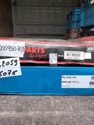 a box of parts that are sitting on the floor