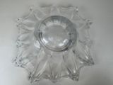 a clear glass bowl with a decorative design on it