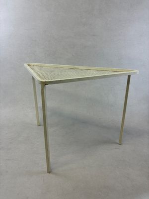 an image of a white table with a triangular top on a white background