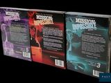 three books are stacked on top of each other on a black background