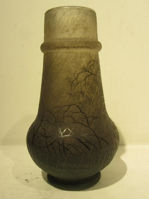 a vase that is sitting on a white table