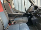 the interior of a van with the front seats up and the passenger seat down