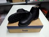 a box with a pair of black boots on top of it