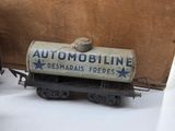 a toy train car with a sign on the side of it