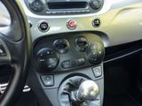 a car dashboard with a steering wheel and a control panel