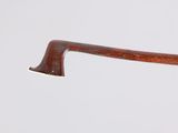 a close up of an old wooden handle on a cane