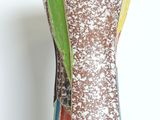 a vase that has a multi colored design on it