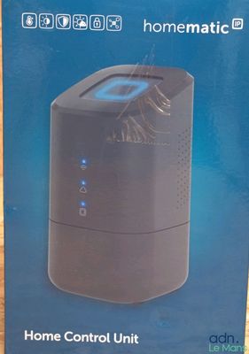 the box of a home control unit is sitting on the table