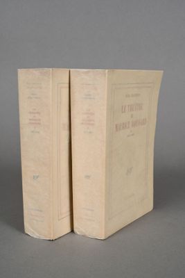 pair of two books sitting on top of each other on a table