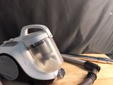 a vacuum that is sitting on a wooden table