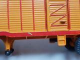 a close up of a toy truck on a white surface
