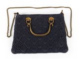 a close up of a black purse with a gold handle