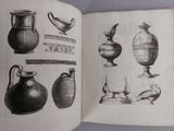 an open book with drawings of vases on it