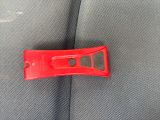 a close up of a red object on the seat of a car