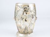 a glass vase that is sitting on a stand